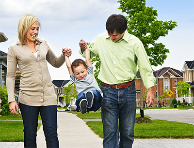 Family walking on a sidewalk